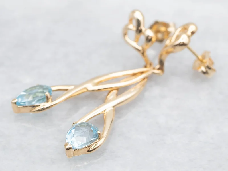 Ladies earrings copper tone designs-Twisting Gold Blue Topaz Drop Earrings