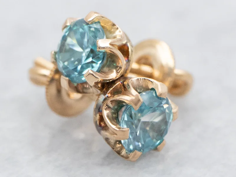 Ladies earrings star motif designs-Screwback Blue Zircon Stud Earrings in Gold Buttercup Setting